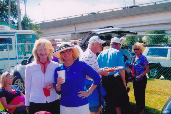 Laurie Geofgia fan and Florida fan celebrate Florida-Georgia tailgate photo by Laurie Cordell