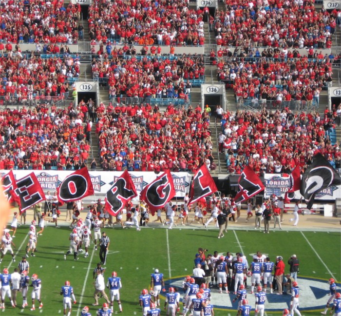 Georgia cheerleaders leading the team onto the field Florida Georgia game photo by Kathy Miller