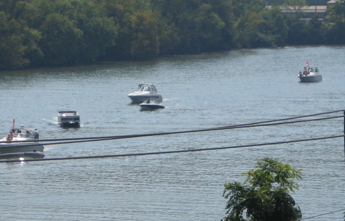 Boats making their way up the Tennessee River for Vol Navy Knoxville photo by Kathy Miller