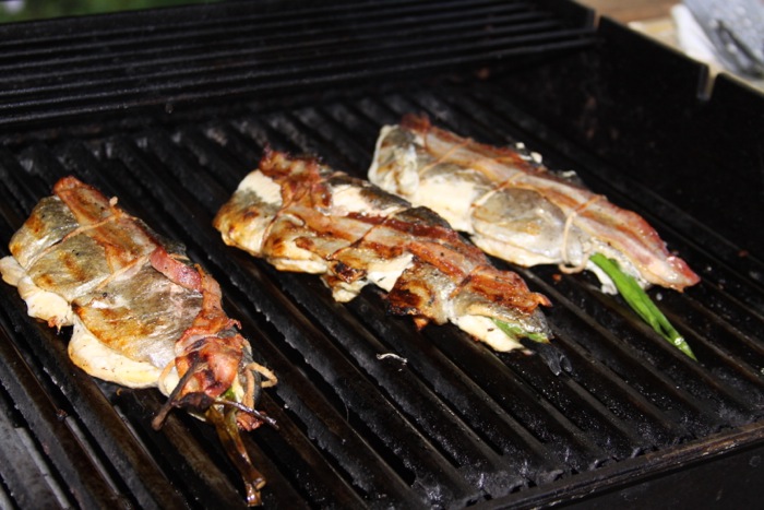 Charred bacon wrapped fresh local rainbow trout photo by Kathy Miller