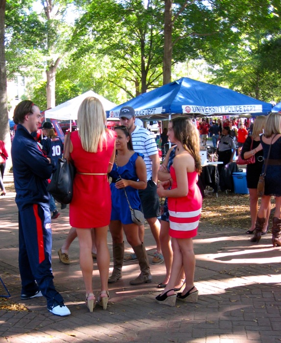 Dresses and high heeled shoes and boots at a tailgate in The Grove photo by Kathy Miller