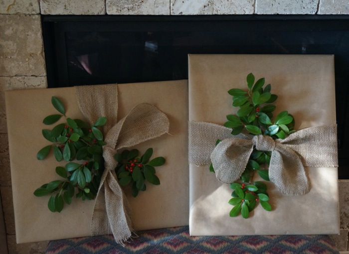SEC tailgating prints wrapped in craft paper, tied with burlap ribbon and holly greenery with berries photo by Kathy Miller