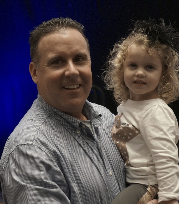 Young Duke fan with her dad photo by Kathy Miller