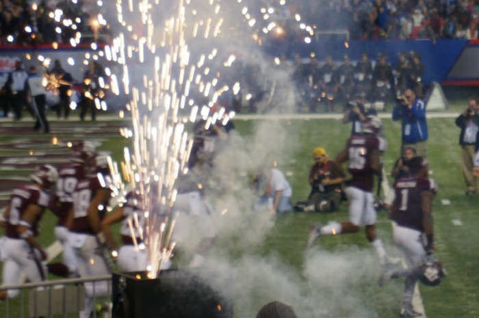 Aggies storm the field photo by Kathy Miller