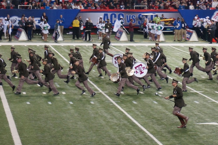 Aggie Band running off the field photo by Kathy Miller