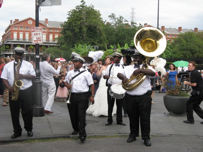 Wedding Celebration New Orleans with band, marching down the street photo by Kathy Miller