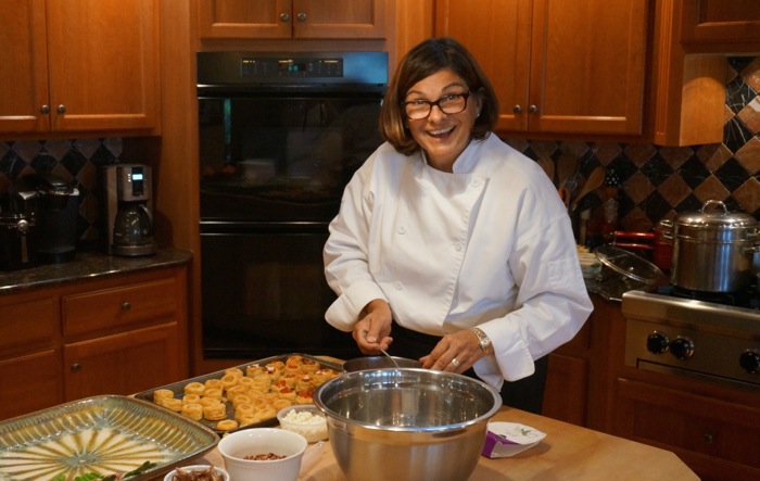 Karen fills the bruschetta cups photo by Kathy Miller