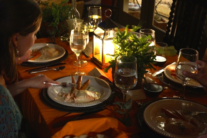 Baked Salmon by candlelight on the orange table photo by Kathy Miller