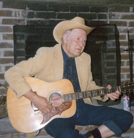 Strumming the Old 6 String Jim Lovett photo by Kathy Miller