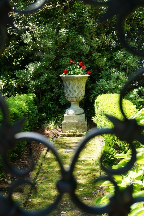 The urn at Thomas Rose house viewed through the wrought iron gates photo by Kathy Miller