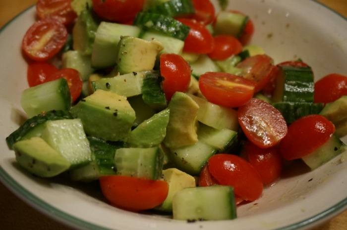 Cucumber, grape tomatoes, avocados with dressing photo by Kathy Miller