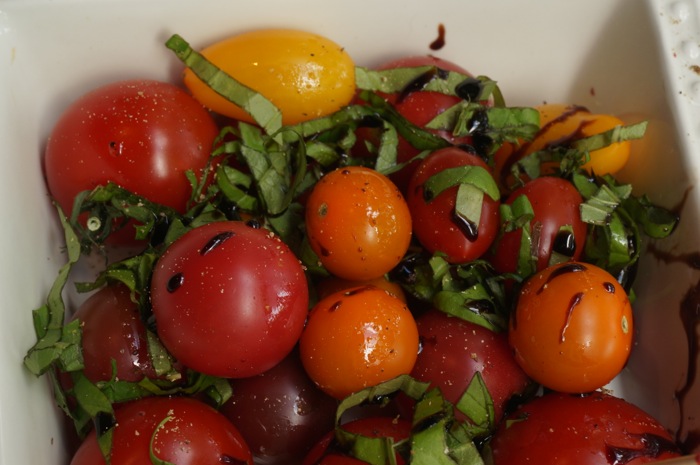 Gourmet Cherry Tomato Assortment Drizzled with olive oil, balsamic glaze and basil photo by Kathy Miller