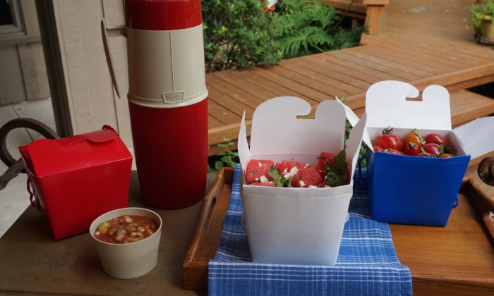 Portability with red, white, and blue take out boxes and vintage Thermos jug photo by Kathy Miller