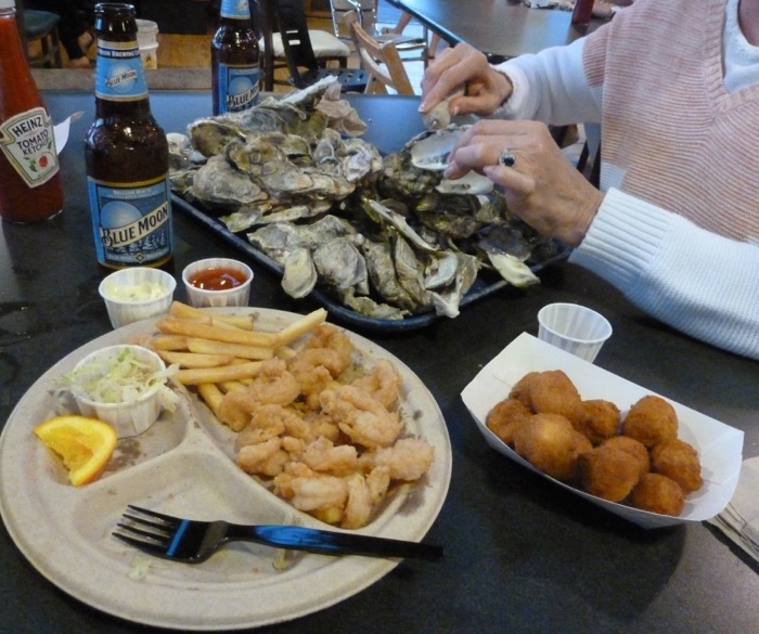 Guess who's shucking oysters looking for the mother lode photo by Laura Huffman