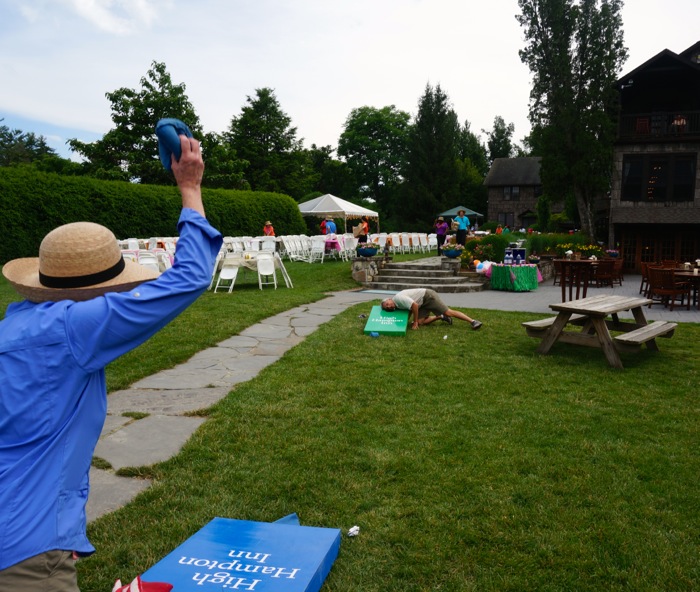 Susan winding up her corn hole toss photo by Kathy Miller