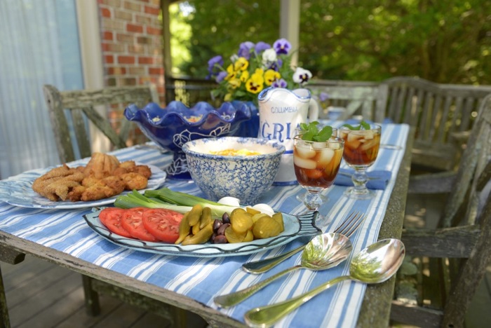 Catfish Fry table spread with blue and white tablecloth and serving pieces photo by Joy McCabe