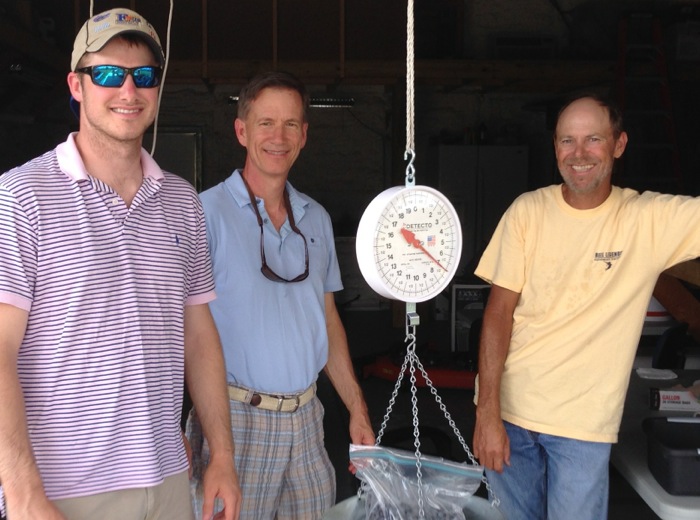 James, Dave and Wayne Bunk weighing the blueberries photo by Kathy Miller