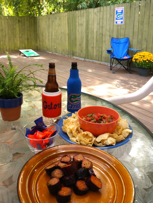 Tailgating at Pops' Place with chips and salsa and sausage photo by Kathy Miller