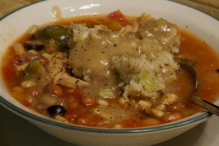 Potato Stuffing drizzled with Turkey Gravy tops a Kitchen Sink Soup photo by Kathy Miller