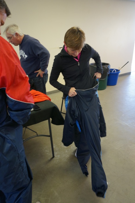 Clara dons flight suit for hang gliding photo by Kathy Miller