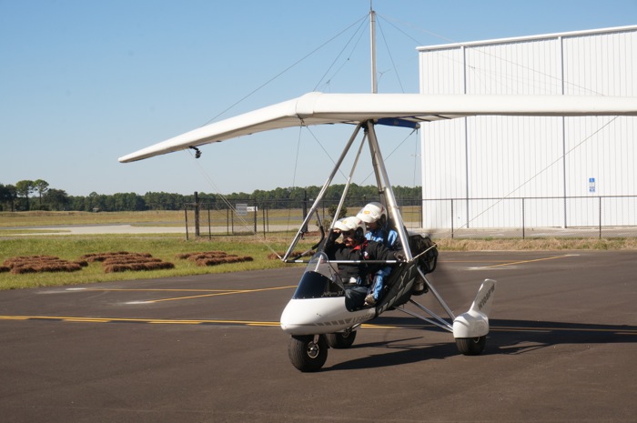 Clara and Gene leave hangar area photo by Kathy Miller