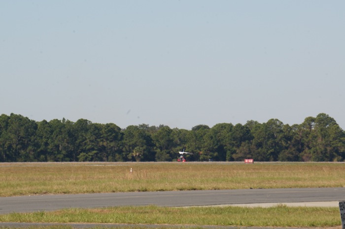 Dave's trike taxiing down runway for takeoff photo by Kathy Miller