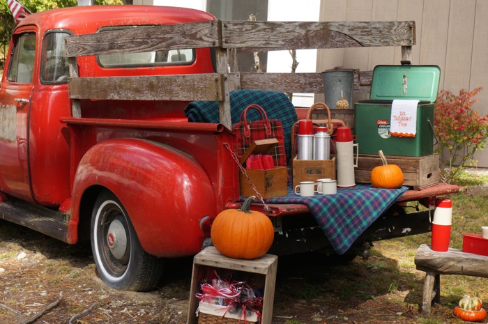 Vintage Tailgate, red truck, vintage Thermos picnic containers, vintage cooler photo by Kathy Miller