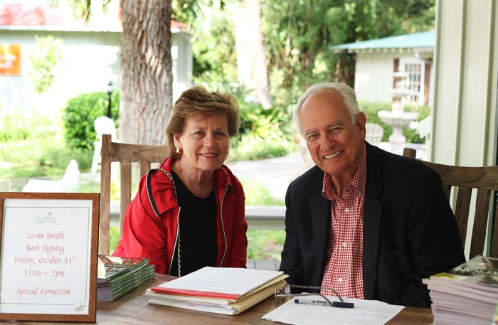 Myrna and Loren Smith with new tailgating book, Spread Formation photo by Lynne Tennille at the Plantation Shop 