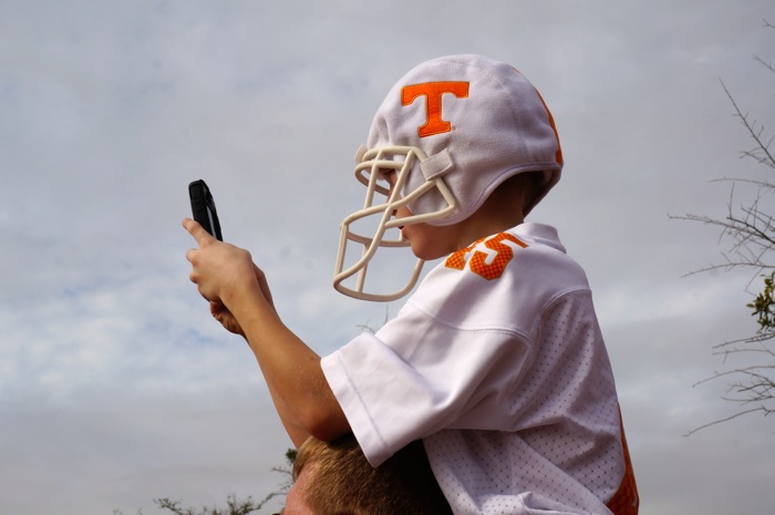 Young Tennessee fan captures Vol Walk from his dad's shoulders photo by Kathy Miller