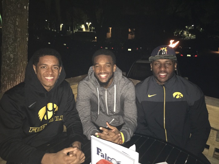 Iowa players take a break during TaxSlayer Bowl photo by Kathy Miller