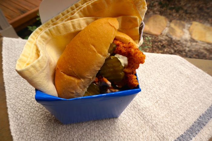 Chicken Hot Wings on a Bun with Black Pepper Ranch and Frank's Hot Sauce with Dill Pickle Chips photo by Kathy Miller