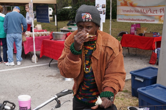 Felix Jones, the Peanut Man plays his harmonica photo by Kathy Miller