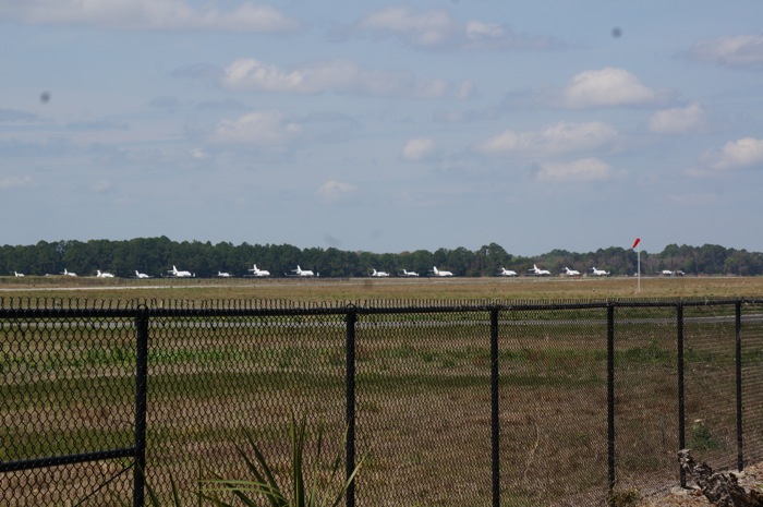 Jets parked on runway Fernandina Beach Airport for the Concours d'Elegance photo by Kathy Miller