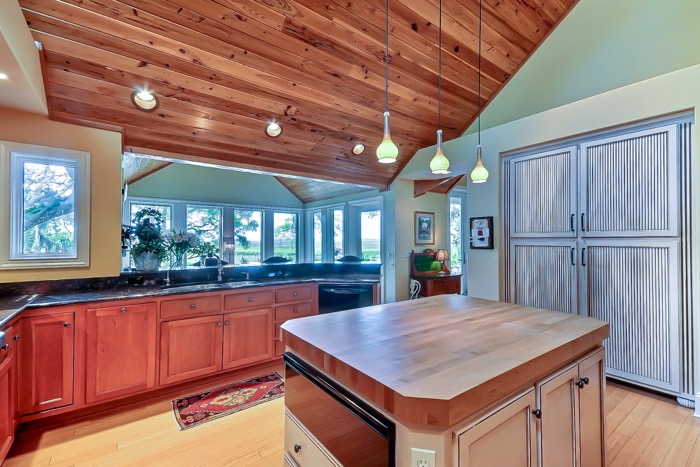 View from kitchen to sunroom and marsh 