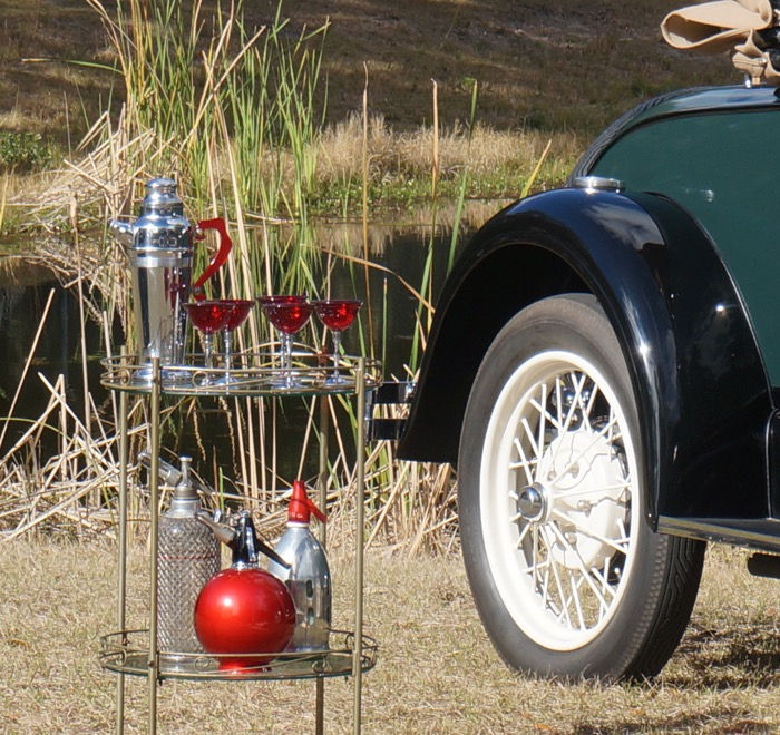 Vintage Seltzer bottles and chrome and red Bakelite cocktail shakers and glasses photo by Kathy Miller