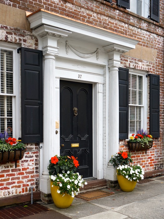 Great Charleston House with yellow pots filled with flowers photo by Kathy Miller