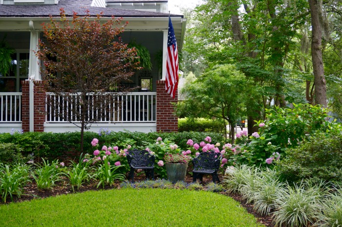 Amelia Park brick home with American flag, photo by Kathy Miller