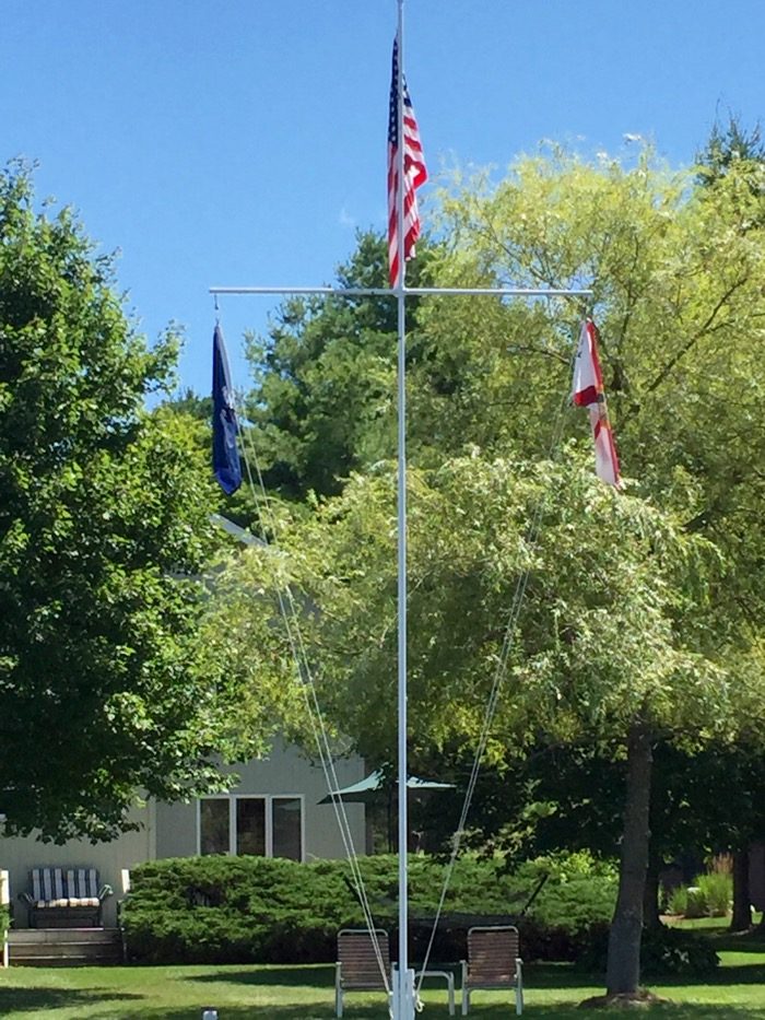 Flynn house with flags on Lake St. Catherine photo by Kathy Miller