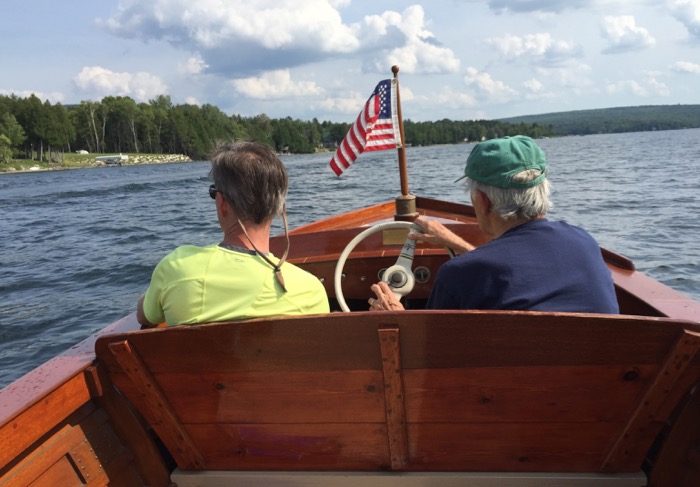 Dave and Ron on the old Chris-Craft boat photo by Kathy Miller