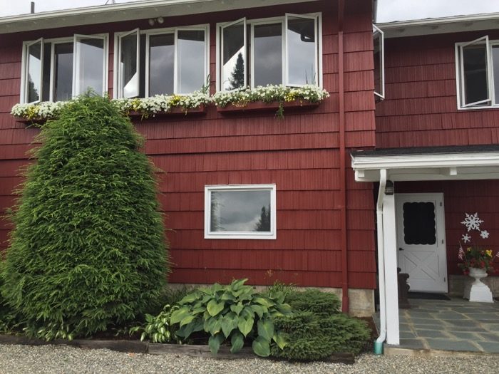 The front entrance to Camp Winape Ski Lodge with snowflake photo by Kathy Miller