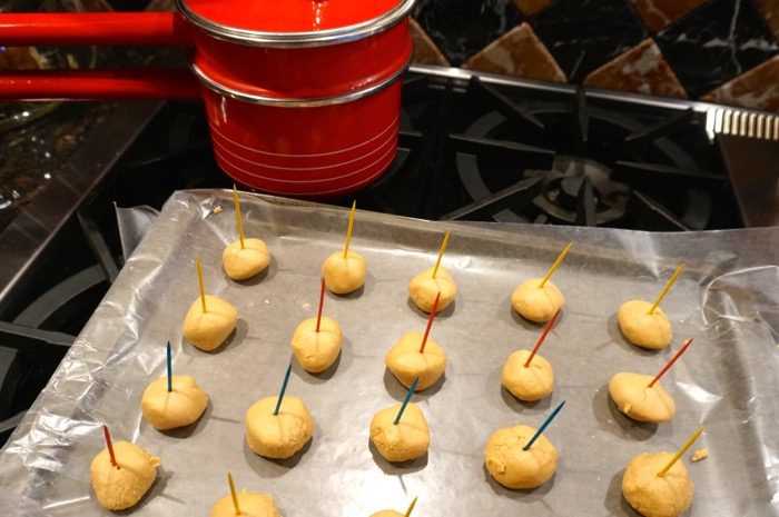 Making peanut butter buckeyes berfore dipping photo by Kathy Miller