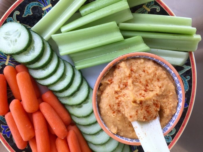 Spicy Sweet Potato Hummus with celery, cucumbers, and carrots photo by Kathy Miller
