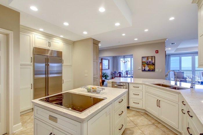 View from kitchen to dining area with Subzero refrigerator