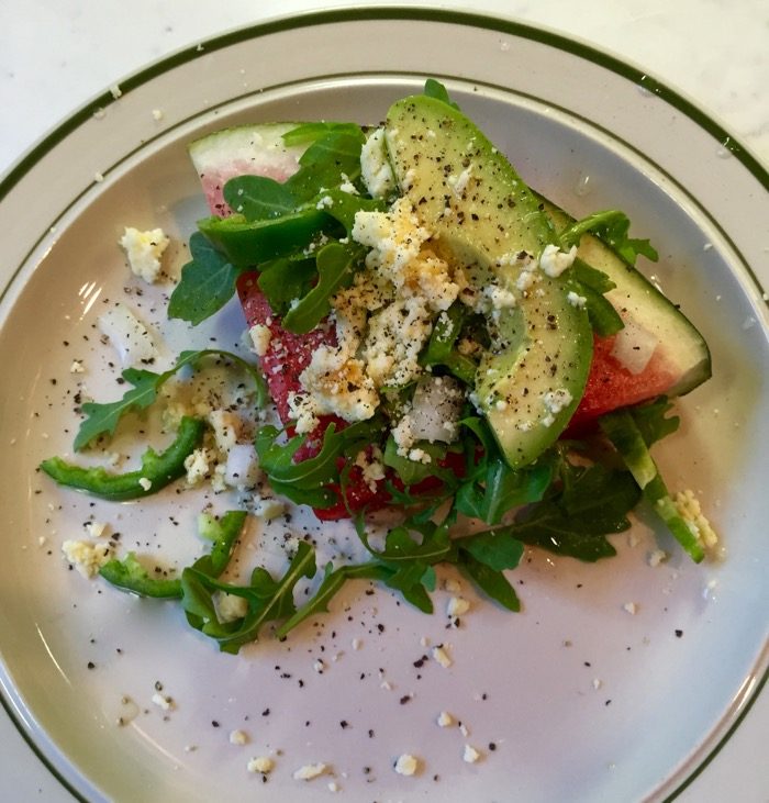 Watermelon Wedge Salad with arugula, avocado, jalapeno, and White Stilton Cheese with mango and ginger photo by Kathy Millaer