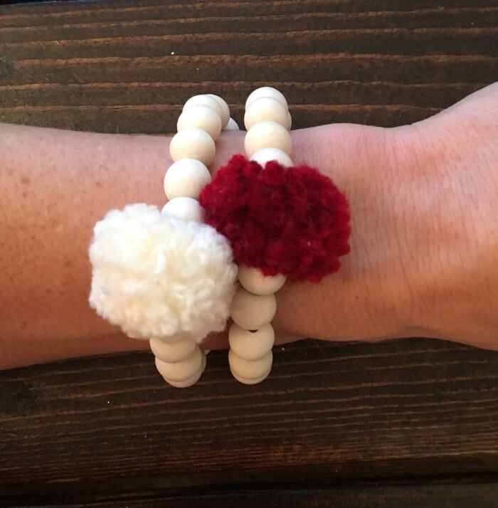 Oklanoma Crimson and Cream Pom Pom Bracelet stack