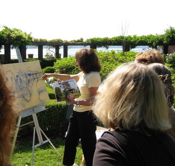 Ellen Diamond painting in the Cummer Gardens photo by Kathy Miller