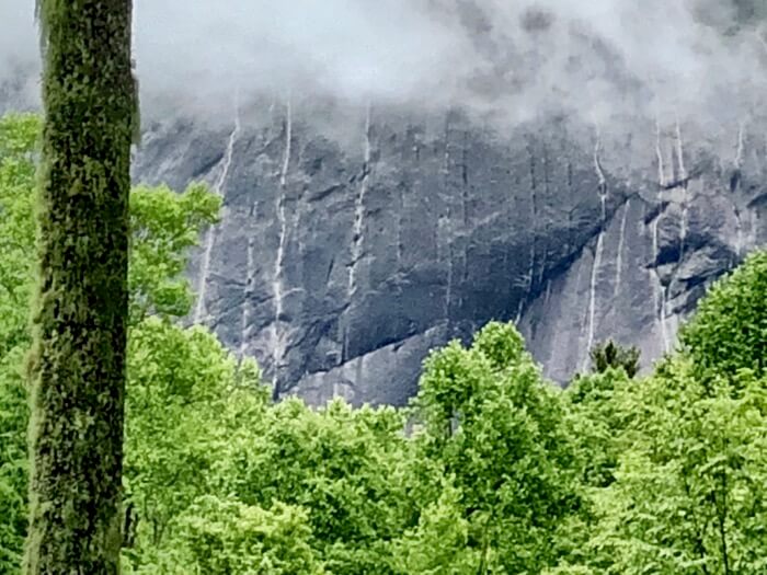 Laurel Knob waterfalls streaming over the rock face photo by Kathy Miller