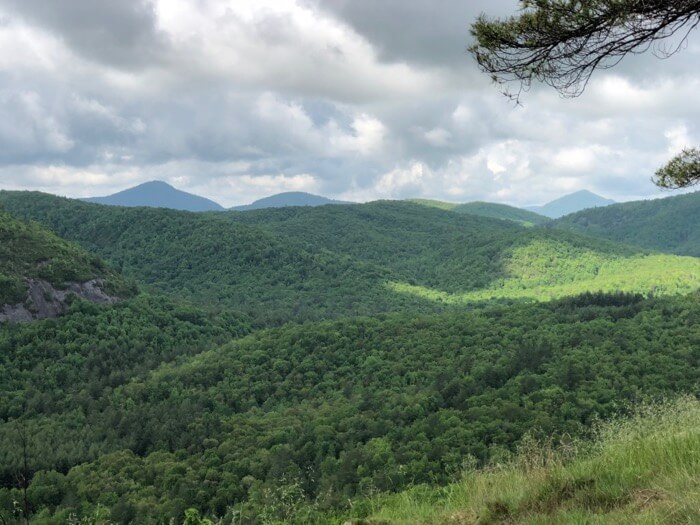 View of Chimney Top Mountain, Rock Mountain and Whiteside Mountain from Blackrock Mountain in Panthertown photo by Kathy Miller