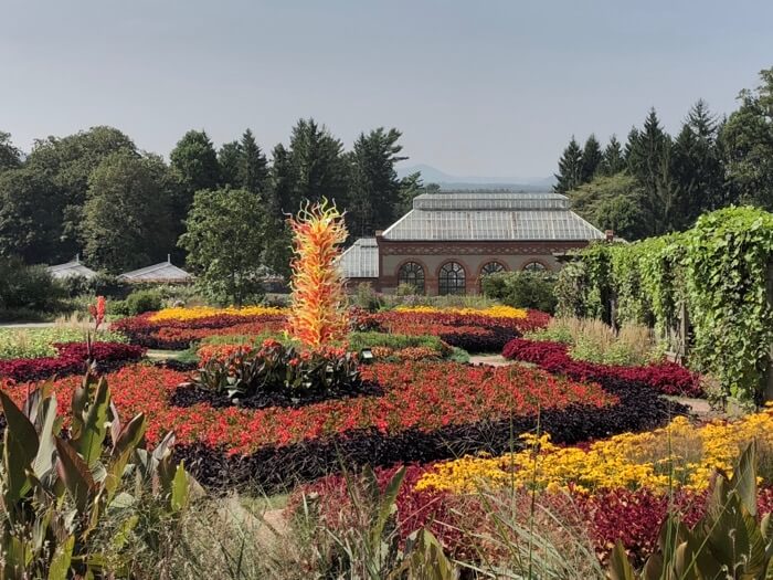 Electric Yellow and Deep Coral Tower II- Chihuly at Biltmore photo by Kathy Miller