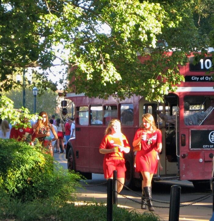 Red double decker bus traveling to and from The Grove and Oxford photo by Kathy Miller